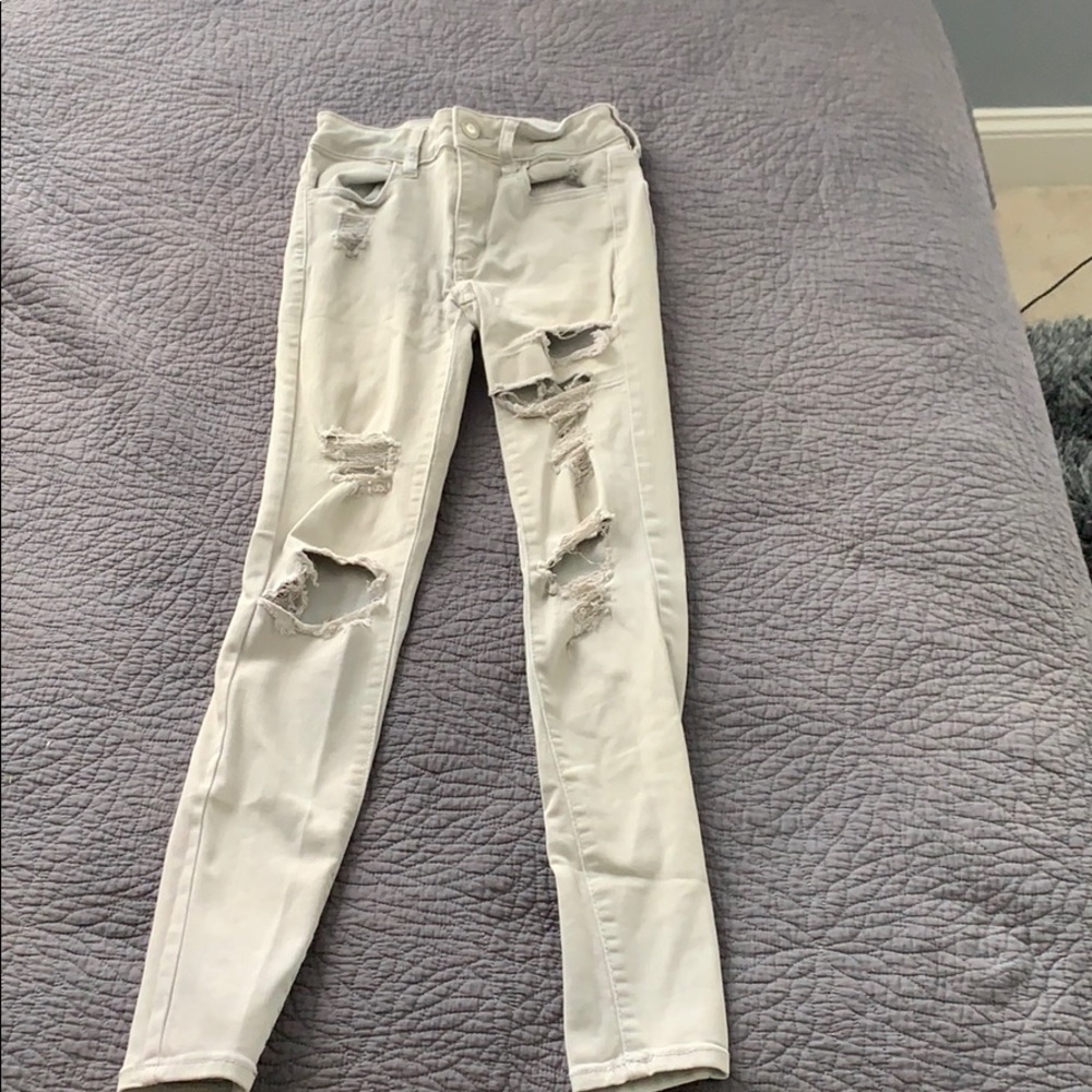 Beige ripped jeans